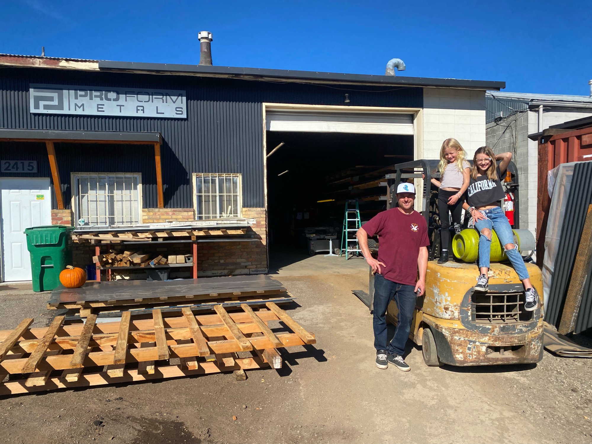 Keith Goguen and family outside the Pro Form Metals shop in Reno, NV