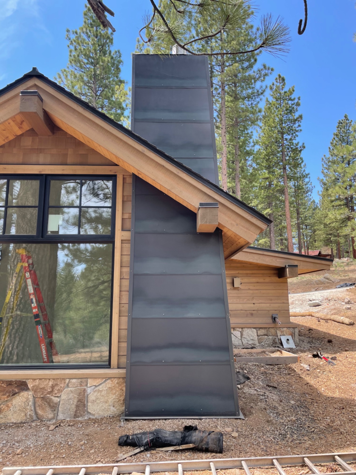 Custom metal chimney chase on mountain home