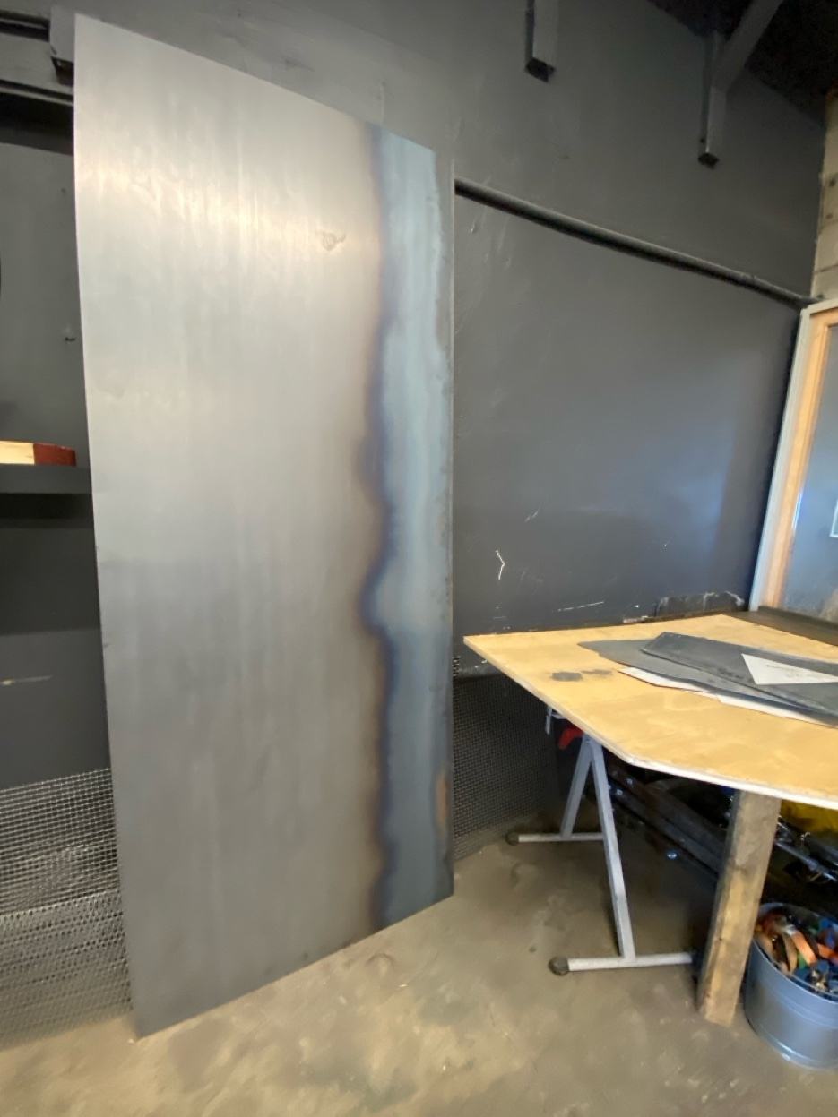 Hot rolled steel panel for fireplace surround